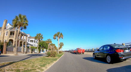 Fototapeta na wymiar CHARLESTON, SC - APRIL 7, 2018: City oceanfront with tourists on a sunny day. The city attracts 10 million tourists annually