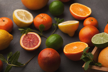 Heap of citruses on white wood, closeup