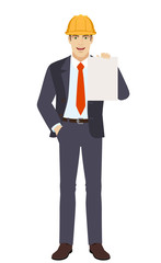 Businesswoman in construction helmet with hand in pocket showing the blank paper