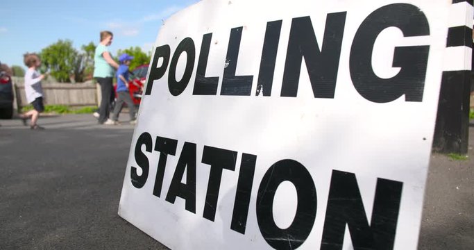 An Anonymous British Family Voting In A General Election At A Polling Station, UK. 