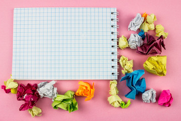  Crumpled Color paper balls and notepad. Empty space for text and design