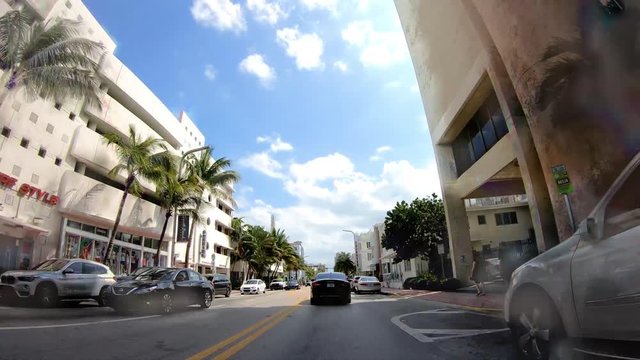 Fast time lapse of traffic along Collins Ave as seen from moving car. Miami is the major city of Florida