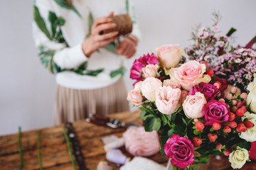 Florist makes a bouquet.