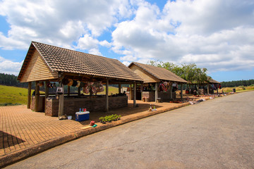 Fototapeta na wymiar Curios shops on the parking of the Berlin Falls in the Blyde River Canyon area, Mpumalanga district of South Africa