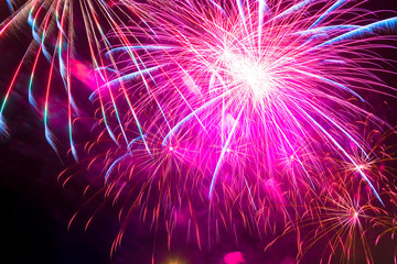 bright pink beautiful salute in the night sky at the event