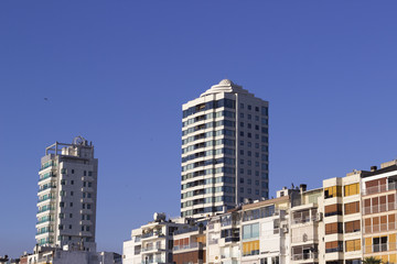 Fototapeta na wymiar Side view cropped shot of building blocks under open sky