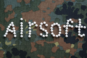 inscription airsoft plastic balls bbs on camouflage fabric