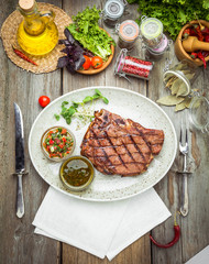 Tenderloin steak on plate with sauce