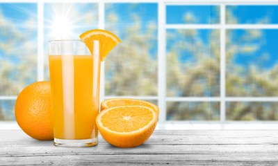 Orange Juice in glass on desk