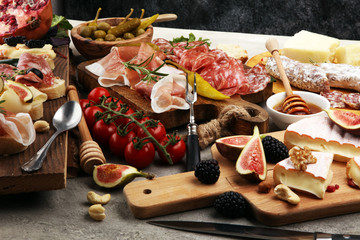 Italian antipasti wine snacks set. Cheese variety, Mediterranean olives, pickles, Prosciutto di...