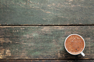 Cup of coffee on grey wooden table