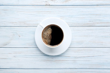 Cup of coffee on wooden table