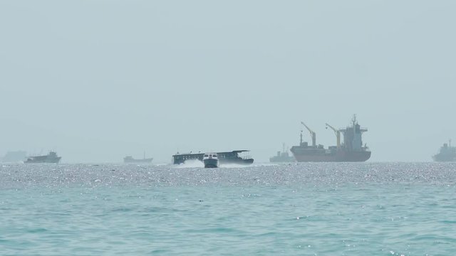 Various Boats And Ferries Transfering Goods And Passengers Over The Turquoise Ocean Waters At Mal&eacute; International Airport In The Maldives.