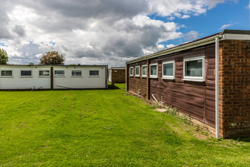 Fototapeta na wymiar Set of bungalows on the grass of a small town in England