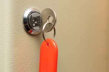 key with a red tag inserted