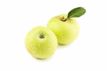 Ripe green apples with water drops isolated on white