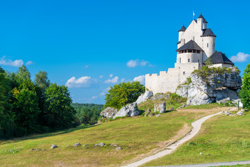 Fototapeta na wymiar Bobolice, Poland - August 13, 2017: Poland's landmark medieval castle Bobolice against the blue sky