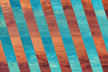 Texture of an oak tree combined with stripes of blue color. Background from brown and blue stripes_
