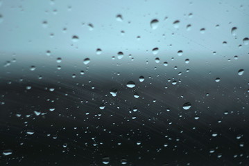 Water drops on glass. The window In rainy weather. Closeup. 