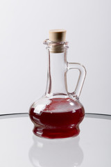 Glass vessel with red liquid. Laboratory flask.