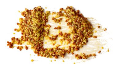Mustard spread over white background
