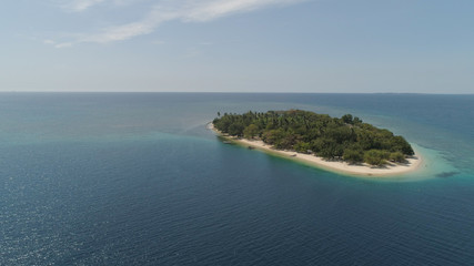 Tropical island with white sandy beach. Aerial view: Putipot island with colorful reef. Seascape, ocean and beautiful beach paradise. Philippines,Luzon. Travel concept.