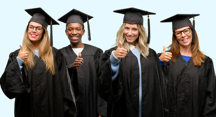 Education concept, university graduate woman and man group smiling broadly showing thumbs up gesture to camera, expression of like and approval