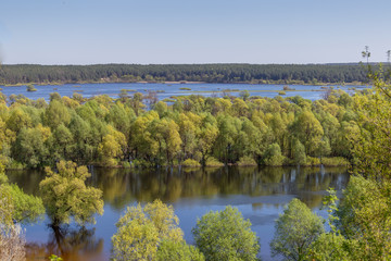 Plakat Aerial landscape view on Desna river with flooded meadows and beautiful fields. View from high bank on annual spring overflow . Novgorod-Siversky, Ukraine.