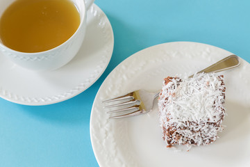 Australian lamington cake, a sponge cake with a coating of chocolate and coconut.