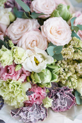 flower arrangement. multicolor bouquet of beautiful flowers on wooden table. Floristry concept. Spring colors. Vertical photo