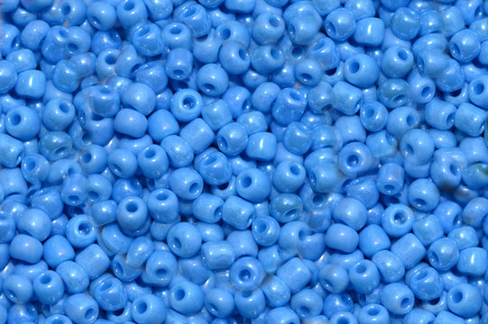 Beautiful background of beads bright blue © Yevhenii