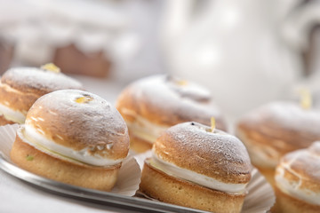 cakes on a tray, restaurant setting.