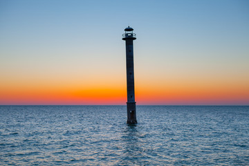Iconic falling Kiipsaare lighthouse at sunset light, island of Saaremaa, Estonia.