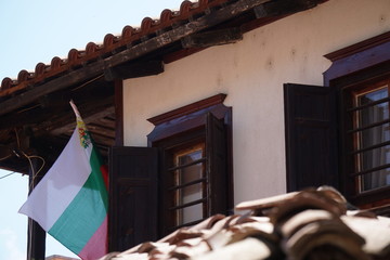 Traditional bulgarian house with flag