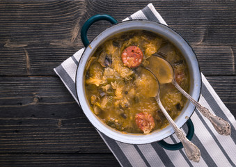 Slovak national christmas cabbage soup with mushrooms on natural background.