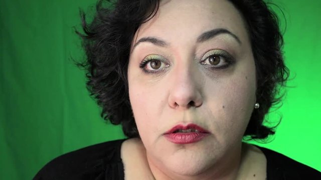 Latina In 40's Applies Eye Makeup