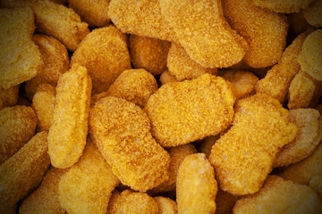 Frozen nuggets spread out evenly as a background.