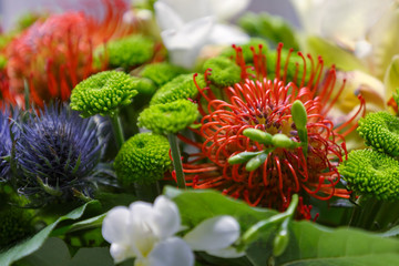 Fototapeta premium Bouquet of colourful exotic flowers close-up as gift
