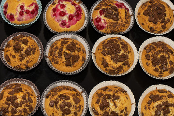freshly baked muffins with fruit in baskets