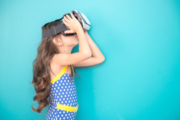 Young VR girl isolated white. Pretty early teenage girl portrait with VR headset. Exciting pose....