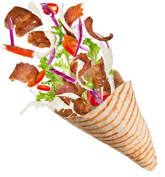 Turkish Kebab yufka with flying ingredients.