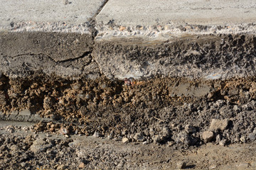 Close up of layers from scraping off of old asphalt in road pavement construction work