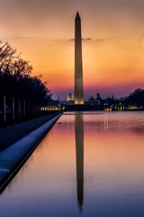 APRIL 8, 2018 - WASHINGTON D.C. - Washington Monument and reflecting pond at sunrise, Washington D.C.