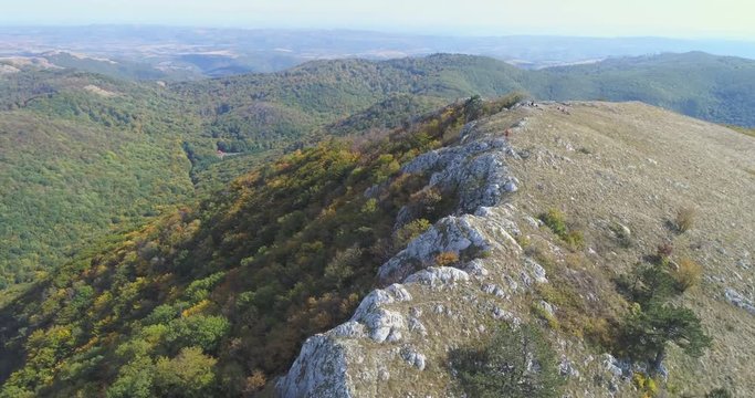 Aerial view of man hiking on the edge of mountain - Transylvania