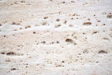 White porous textured tuff. Smooth cut of stone. Close up.