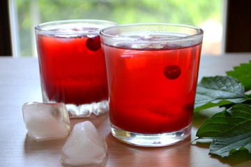 Cranberry juice or lemonade. Red refreshing drink