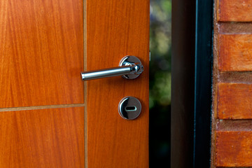 Obraz premium Open door of a family home. Close-up of the lock an armored door.