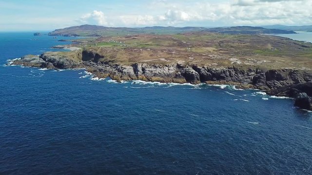aerial footage of beautiful landscape with cliffs and ocean in northern point of Ireland, Malin Head  