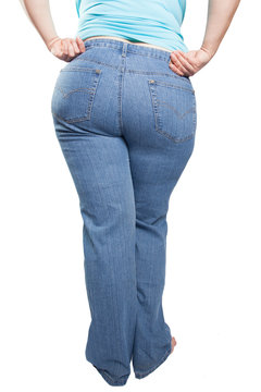 fat woman in blue jeans isolated on white background. Diet concept. (overweight, obesity)