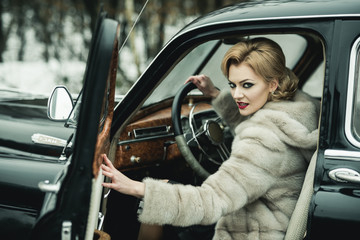 Escort and security guard for luxury woman. sexy woman in fur coat. Travel and business trip or hitch hiking. Call girl in vintage car. Retro collection car and auto repair by driver